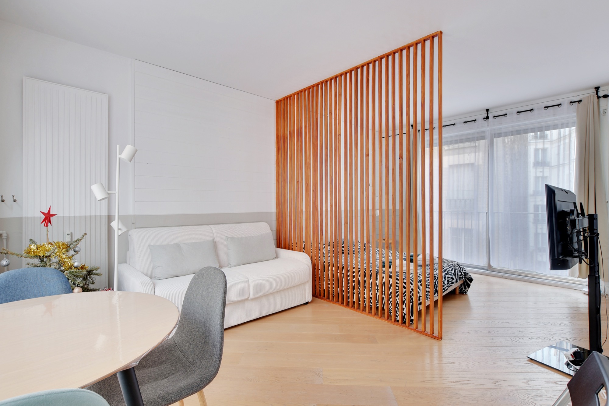 Living area with wood slat divider