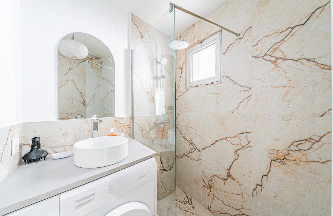 Marble bathroom with walk-in shower